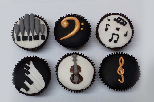 Music themed cupcakes for a musician who plays the violin, piano and organ