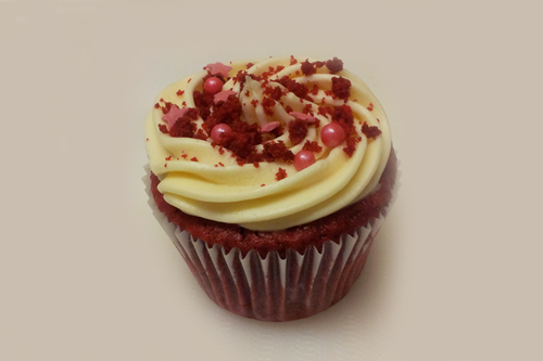 Classic American Red Velvet is so called because of it's velvety textured sponge which is coloured red. The flavour is vanilla with a subtle hint of cocoa, topped with a cream cheese frosting